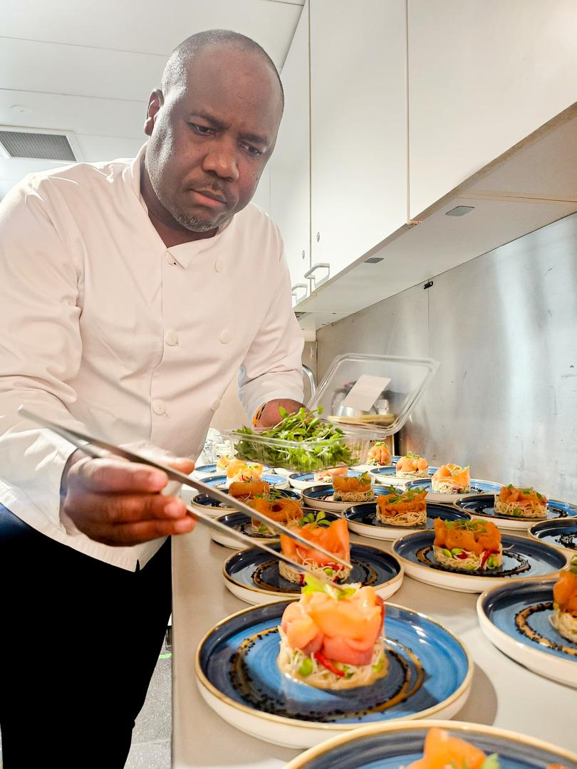 Chef plating salmon dishes