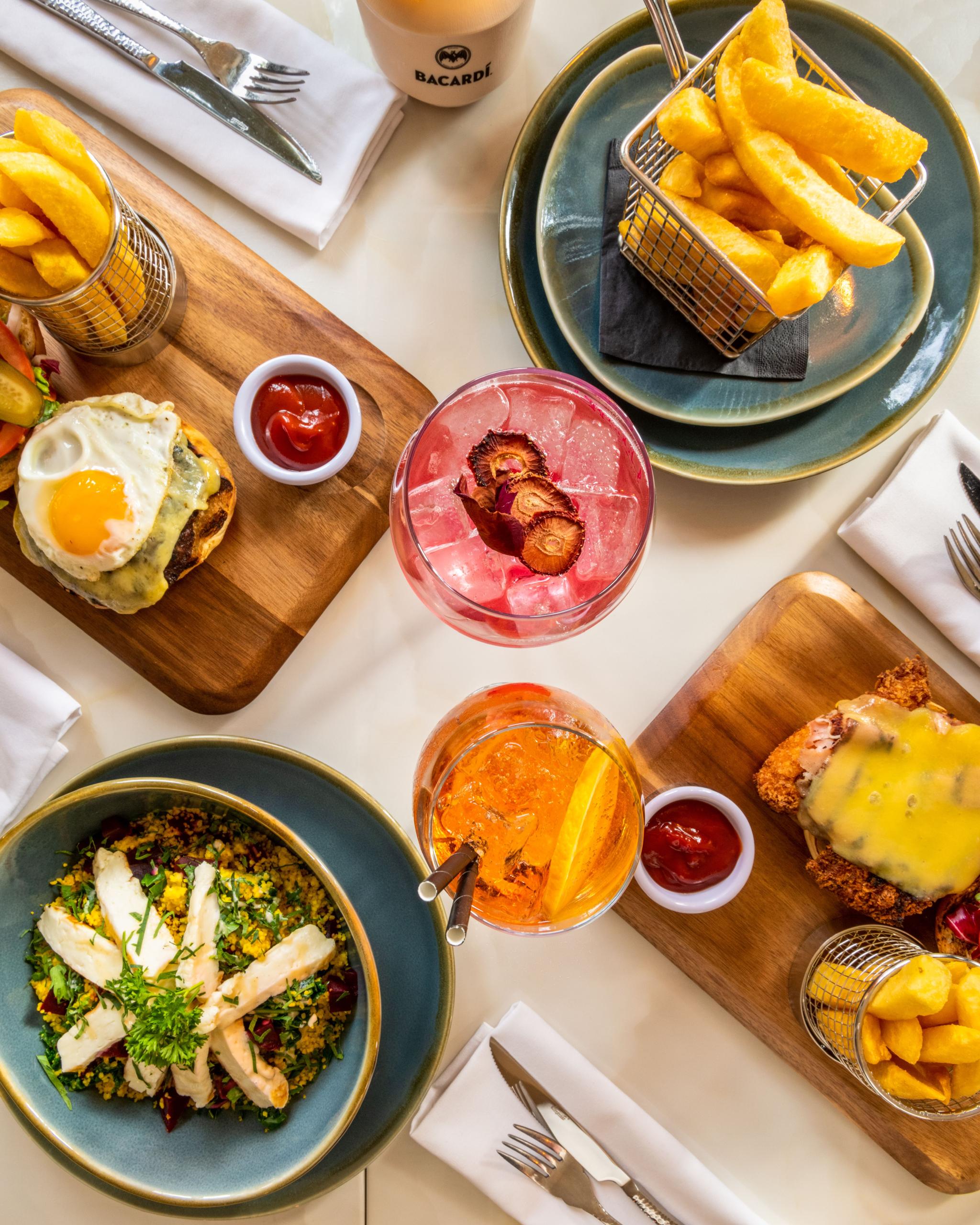 Spread of plated dishes and drinks on a table