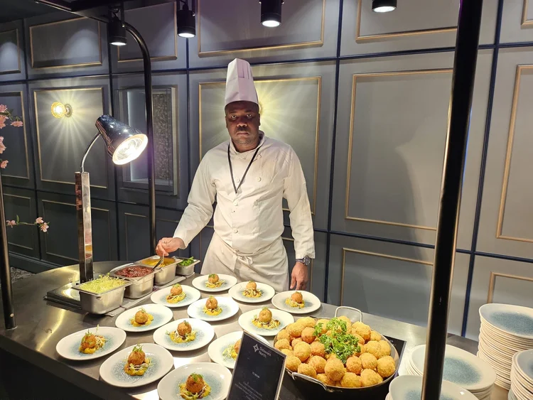 Chef Kone preparing an event buffet