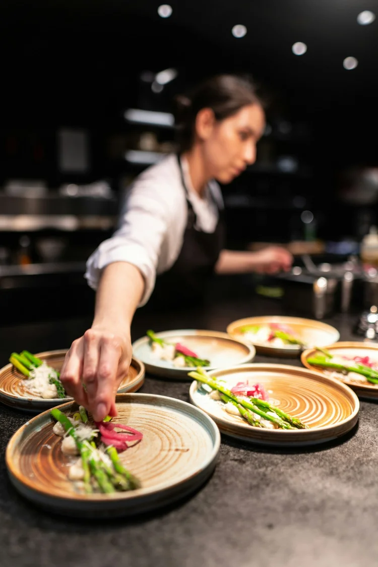 Chef plating a finished dish