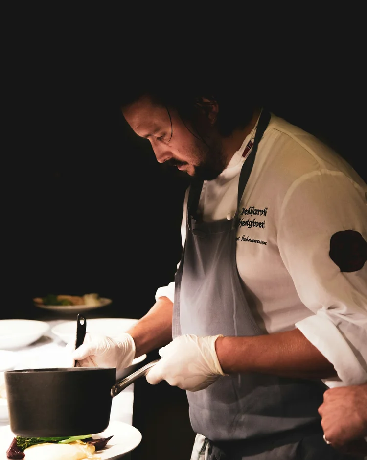 Chef focused on plating during service